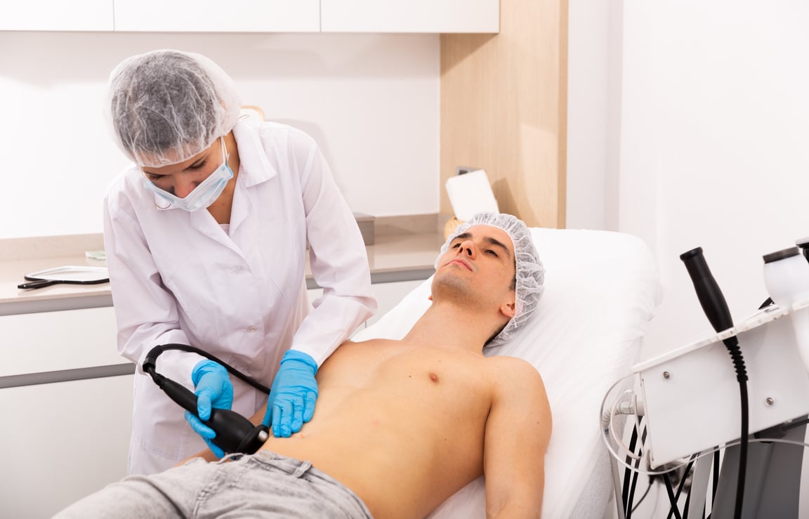 Man getting body ultrasound lifting procedure